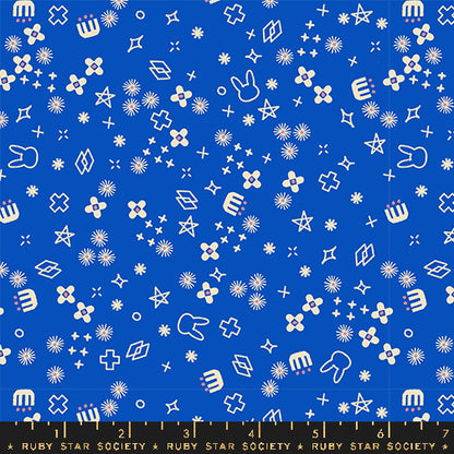 Patterned fabric with white shapes on a blue background, featuring the Ruby Star Society label.