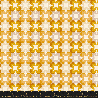 Patterned fabric with geometric design in orange and white on a beige background, featuring Ruby Star Society label.