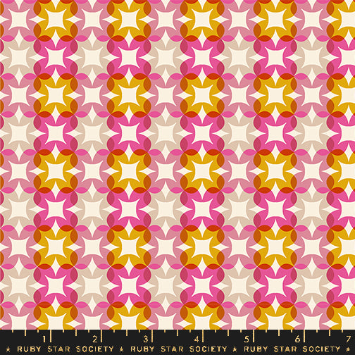 Patterned fabric with geometric design in pink, orange, and white on a beige background, featuring Ruby Star Society label.