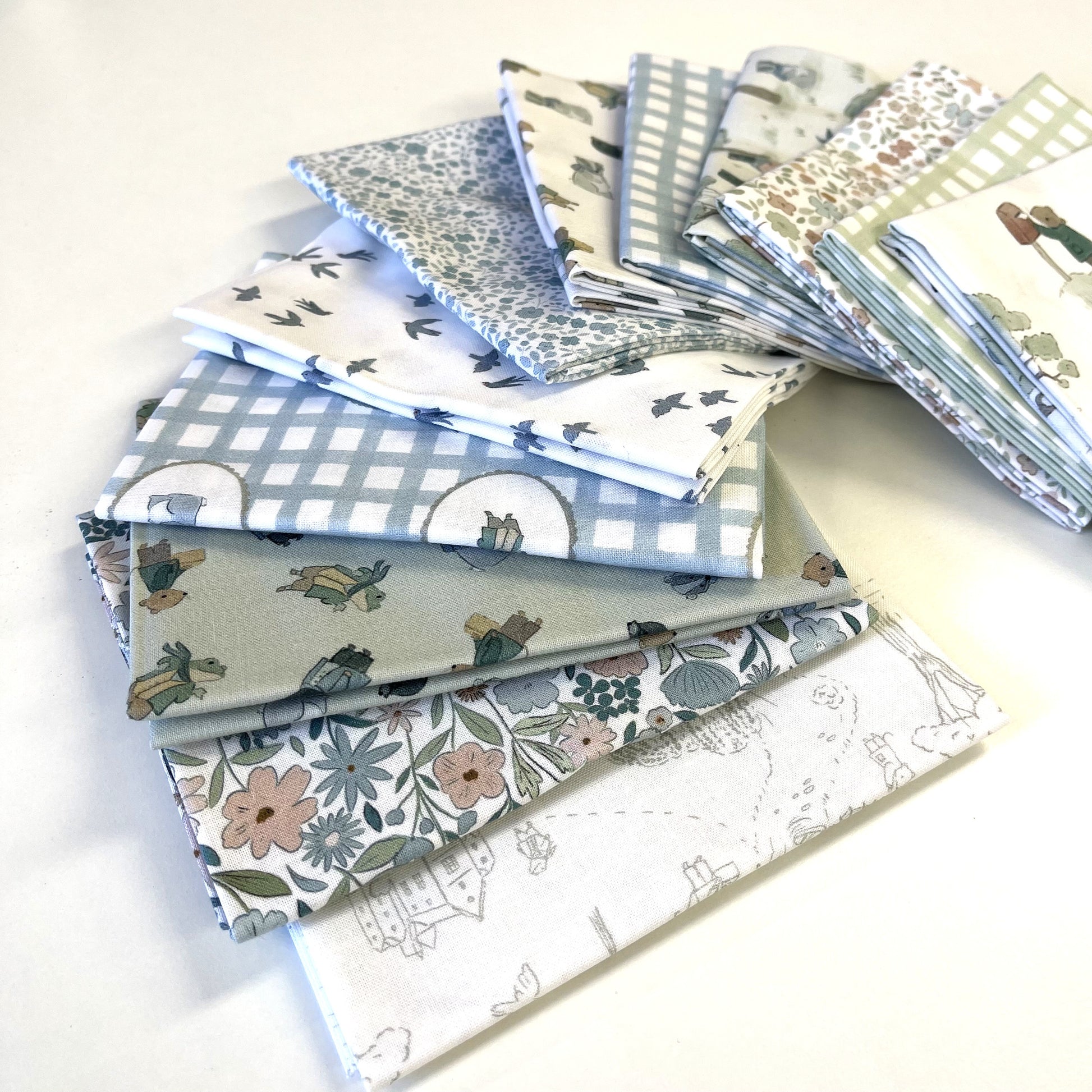 Collection of patterned fabric swatches on a white background