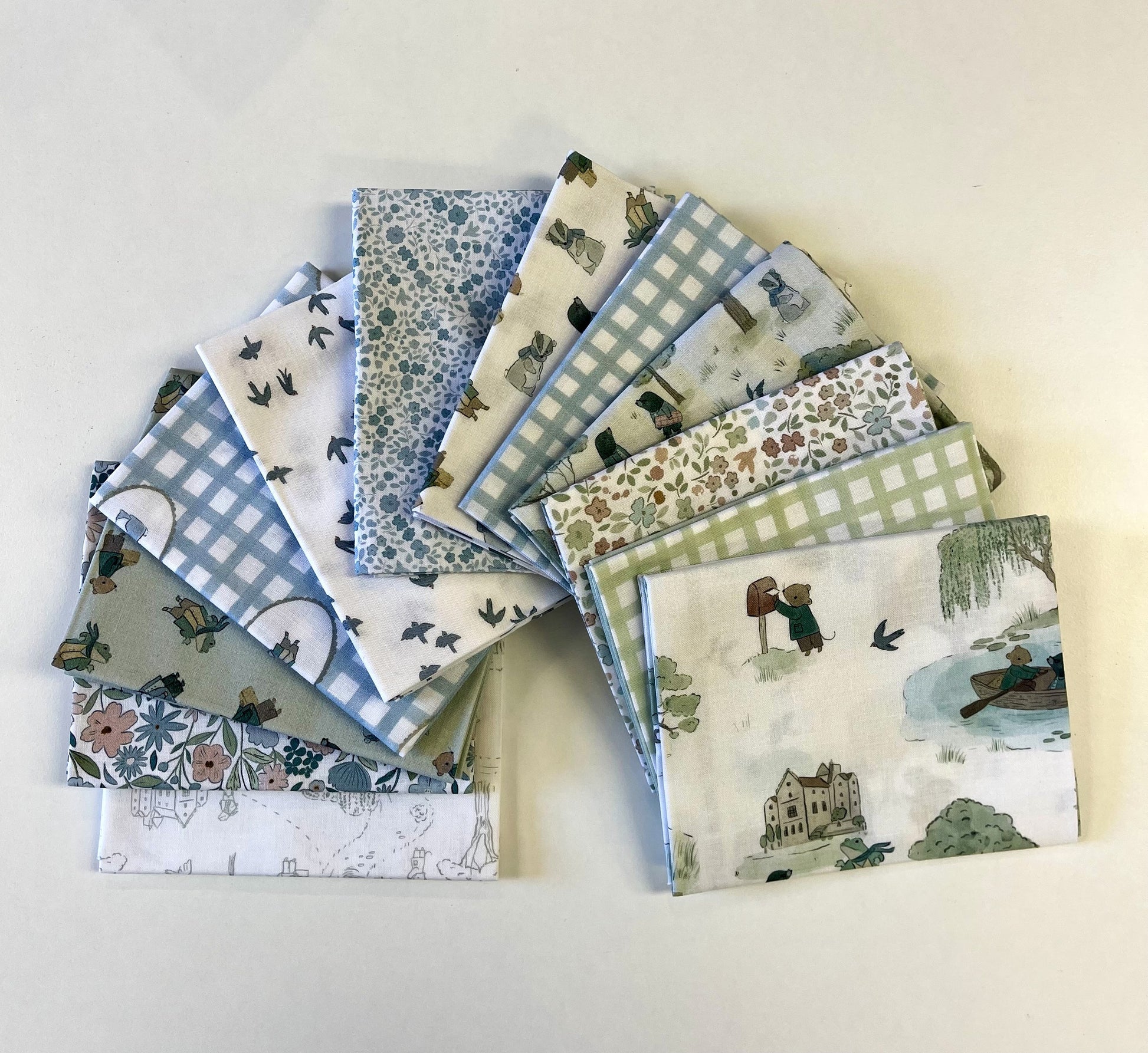 Collection of patterned fabric squares on a light background