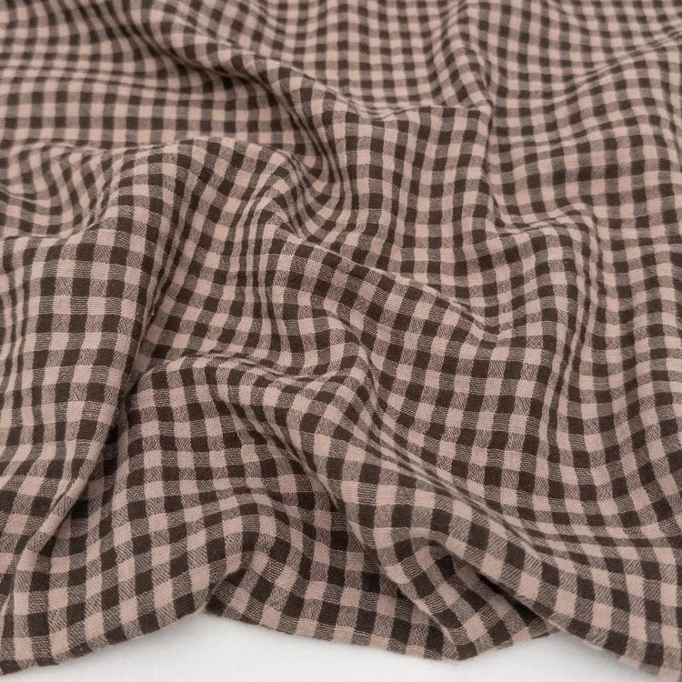 Close-up of brown and beige checkered cotton yarn dyed fabric