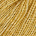 Ball of yellow cotton and wool yarn for knitting and crochet baby