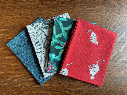 Bundle of 4 fat quarter fabric pieces with a jungle theme. From Boscage art gallery fabric line. 100% premium cotton for sewing and crafting.