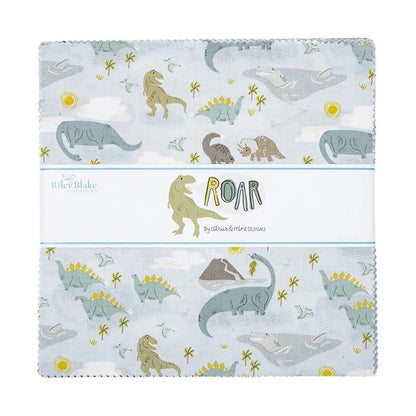 A collection of fabric squares from Riley Blake featuring a pattern with dinosaurs, the sun, clouds, and flowers on a blue and white background.
