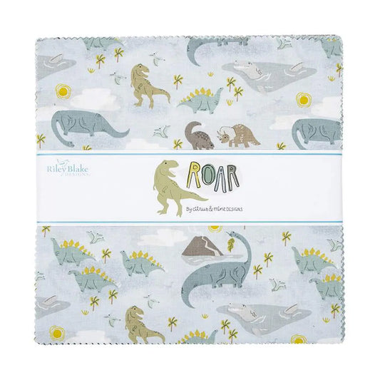 A collection of fabric squares from Riley Blake featuring a pattern with dinosaurs, the sun, clouds, and flowers on a blue and white background.