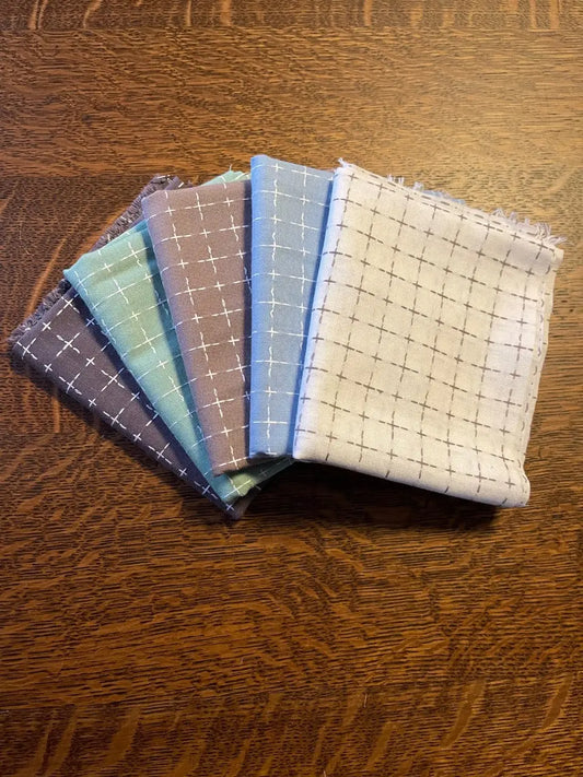 bundle of woven fabric from the Heptic fabric line figo fabrics 100% cotton. 
