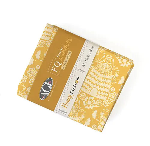 A stack of ten fat quarters with a honeycomb pattern design, branded as Art Gallery Fabrics Honey Fusion. 100% Cotton for sewing, quilting, and crafting.