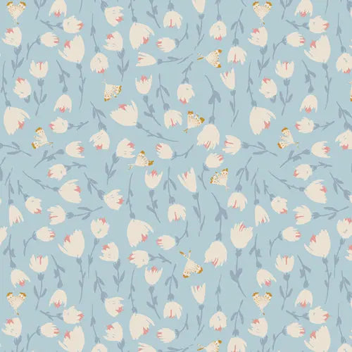 A piece of blue cotton jersey knit fabric with small white flower illustrations. Cotton spandex for sewing. 