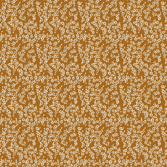 A fabric with an orange background and small white flower bunch pattern. From wild cottage collection figo fabrics fat quarter bundle.
