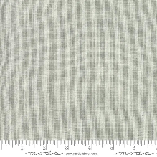 A piece of gray cotton canvas with a dovetail pattern, marked with a tape measure indicating 45 inches in width. 100% cotton by Moda