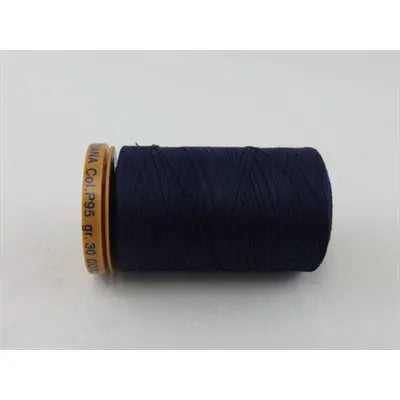 A spool of 28 wt Genziana Italian cotton thread in a navy color.